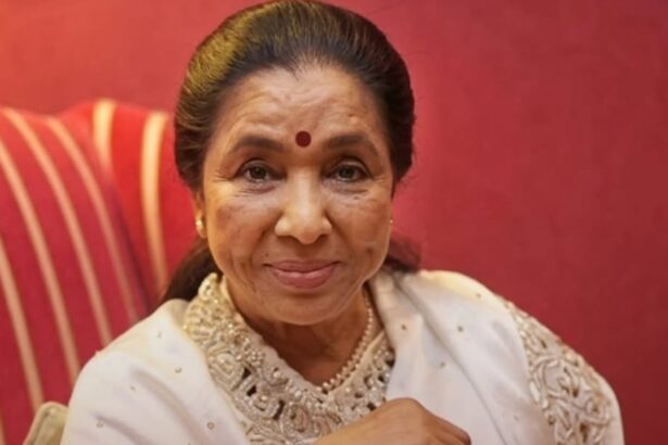 Asha Ji Bhoshle smiling, legendary Indian playback singer and global icon.